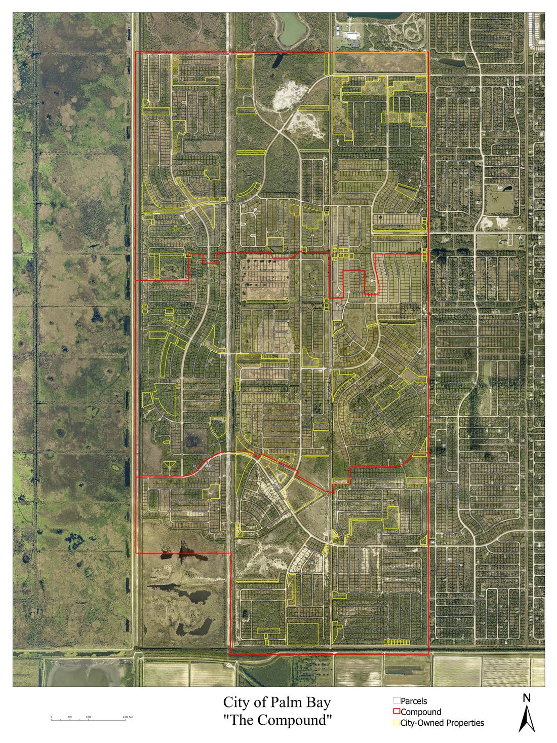 Parcel map showing the full extent of The Compound in Palm Bay, Florida, with individual parcels outlined in yellow and city-owned parcels highlighted in red